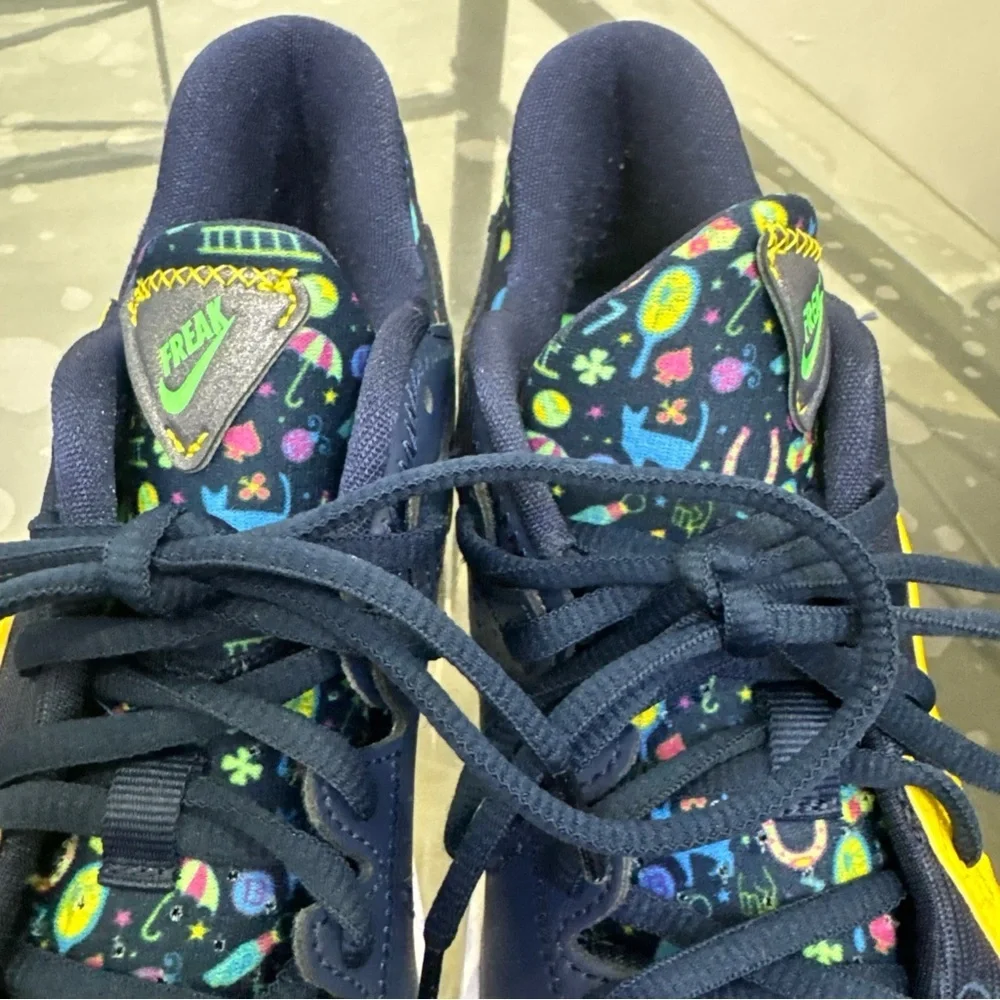 Nike Kids Navy Sneakers with Pink and Yellow Accents